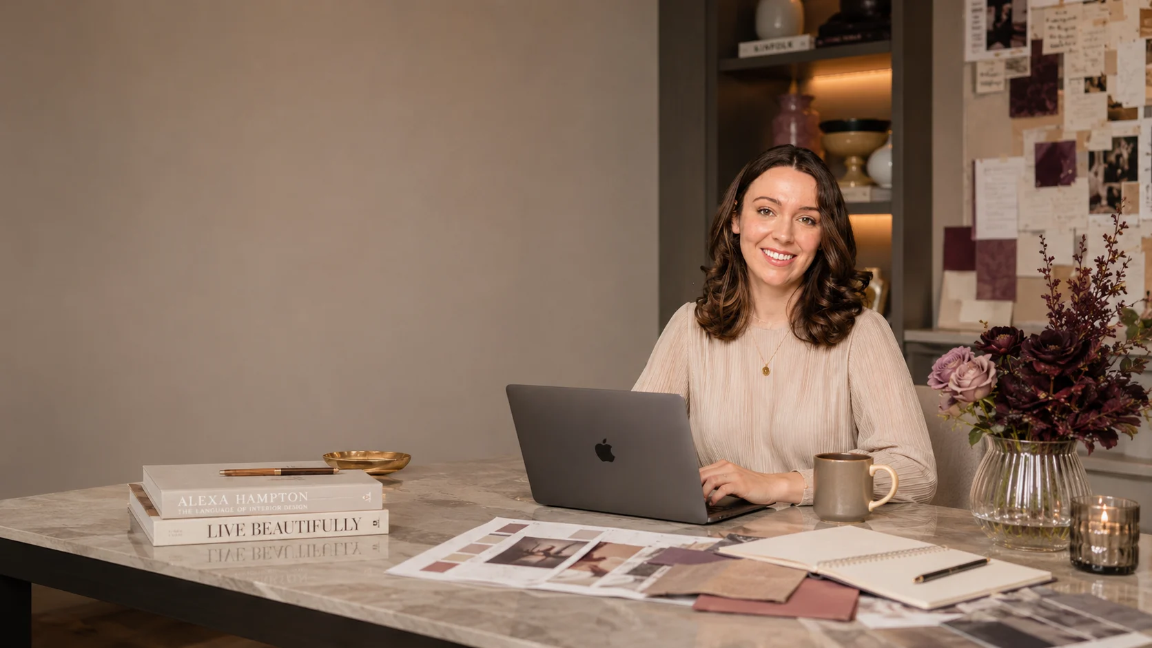 Sara Harmon, creative director and founder of SizzlePop Creative, at her desk